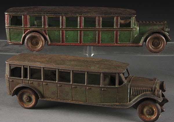 A PAIR OF ARCADE CAST IRON FAGEOL TOY BUSES: A PAIR OF ARCADE CAST IRON FAGEOL TOY BUSES, EARLY 20TH CENTURY, the coast to coast bus with damaged radiator grill. Length 11 inches and 12.5 inches.