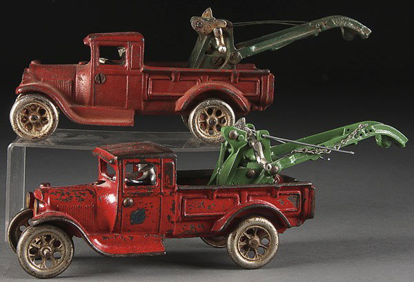 A GROUP OF TWO ARCADE CAST IRON TOY WRECKERS: A GROUP OF TWO ARCADE CAST IRON TOY WRECKERS, EARLY 20TH CENTURY, with original finish. Length 12 inches.