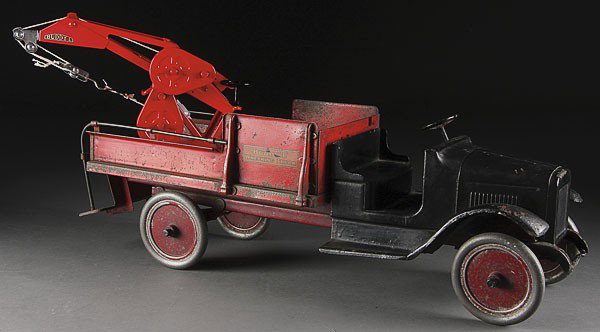 A BUDDY L TOY WRECKING TRUCK, CIRCA 1920S: A BUDDY L TOY WRECKER TRUCK, CIRCA 1920'S, pressed steel with replaced new hoist. Length 27 inches.