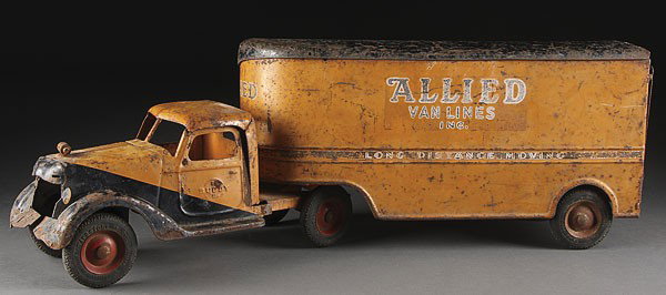 A BUDDY L TOY AMLINES TRUCK, CIRCA 1930S: A BUDDY L TOY AMLINES TRUCK, CIRCA 1930'S, missing front grill and bumper. Length 29 inches.