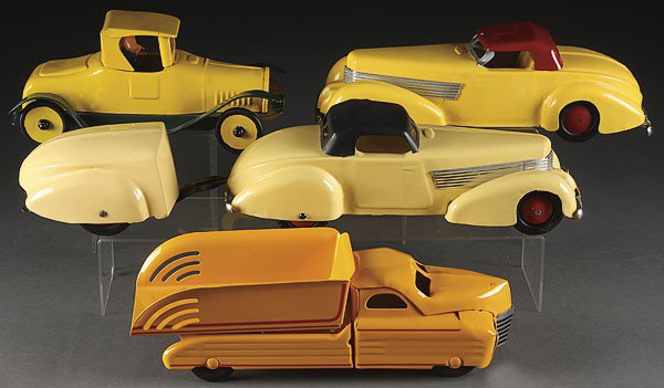 PRESSED STEEL TOYS: BUDDY L & WYANDOTTE: A GROUP OF FOUR PRESSED STEEL TOYS, EARLY TO MID 20TH CENTURY, all restored, including a Buddy L truck and Wyandotte cars, one with a fabricated tear drop trailer. Length 12 inches.
