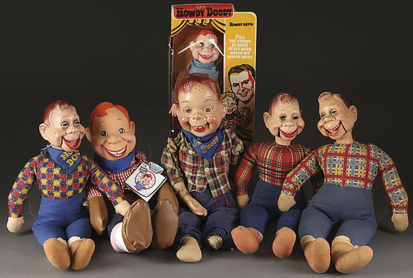 A GROUP OF SIX HOWDY DOODY MARIONETTE DOLLS: A GROUP OF SIX HOWDY DOODY MARIONETTE DOLLS, MID TO LATE 20TH CENTURY, consisting of three hard plastic ideals, a painted composition, a boxed Goldberger and an applause with original tags. The larges