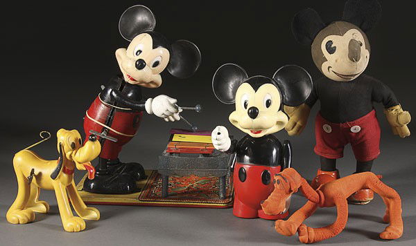 MICKEY MOUSE AND PLUTO VINTAGE TOY GROUP: A FIVE PIECE MICKEY MOUSE AND PLUTO VINTAGE TOY GROUP. Comprising an early knickerbocker figure, a hard plastic wind up xylophone player, wind up Pluto, and bendable Pluto, some losses. Height 11 inch