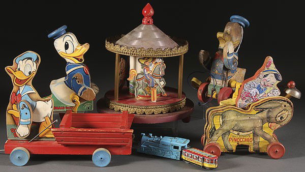 A DONALD DUCK AND PINOCCHIO FISHER PRICE PULL TOY: A DONALD DUCK AND PINOCCHIO FISHER PRICE PULL TOY GROUP, MID 20TH CENTURY, consisting of four Fisher Price pull toys in various condition, together with a Donald Duck musical carousel and partial expr
