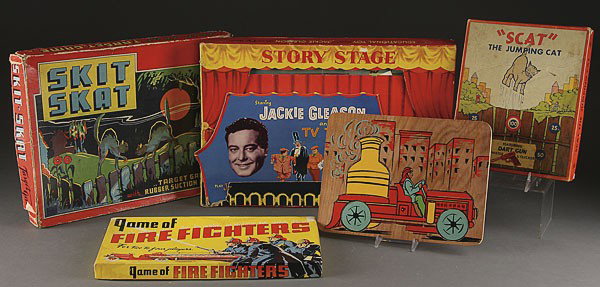 A GROUP OF EIGHT VINTAGE TOYS AND GAMES: A GROUP OF EIGHT VINTAGE TOYS AND GAMES, EARLY TO MID 20TH CENTURY, including fire fighters, Jackie Gleason, Skit Skat, Skat the Jumping Cat, Auto Magic Picture Gun, and other items.