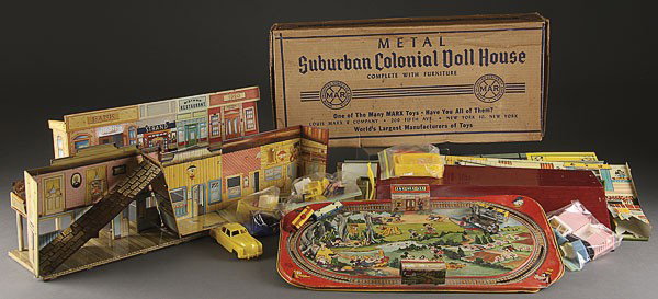 A MARKS LITHOGRAPH METAL COLONIAL DOLL HOUSE: A MARX LITHOGRAPH METAL COLONIAL DOLL HOUSE IN ORIGINAL BOX together with a Roy Rogers Mineral City, a Marx train terminal, and a Mickey Mouse express train by Marx.