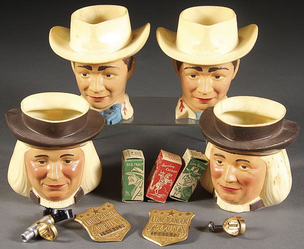 A LONE RANGER ROY ROGERS PREMIUM GROUP, CIRCA 1950: A LONE RANGER ROY ROGERS PREMIUM GROUP. Circa 1950's, comprising two deputy badges, a hopalong Cassidy ring film viewer with three boxed films, two Roy Rogers milk jugs, and two Quaker oats milk jugs,