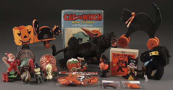 A HALLOWEEN NOVELTY GROUP: A HALLOWEEN NOVELTY GROUP. Mostly semi modern including an animated black cat, a cat and jack-o-lantern candy container, party decorations, a Steiff black cat, together with a vintage plastic Santa pu