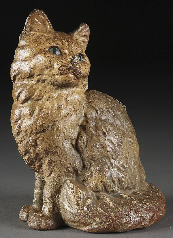 A HUBLEY CAST IRON DOORSTOP, LATE 19TH CENTURY: A HUBLEY CAST IRON DOORSTOP, LATE 19TH CENTURY. Of a seated cat and painted blue eyes. Height 9 inches.