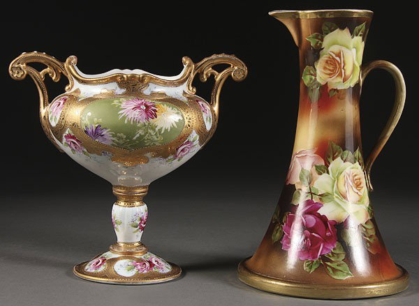 A HAND PAINTED NIPPON PORCELAIN EWER VASE: A HAND PAINTED NIPPON PORCELAIN EWER AND HANDLED PEDESTAL VASE, EARLY 20TH CENTURY. Height 10 inches.