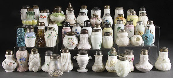57 PIECE VICTORIAN OPAQUE COLORED GLASS SHAKERS: A 57 PIECE COLLECTION OF VICTORIAN OPAQUE AND COLORED GLASS SHAKERS, 19TH CENTURY. Assorted patterns and makers including tulip, rib base 21, swirl and bulge, footed lobe, scroll wave, paine apple and
