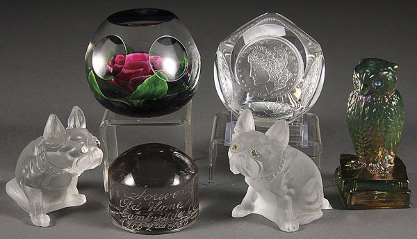 AN AMERICAN GLASS PAPERWEIGHT GROUP: AN AMERICAN GLASS PAPERWEIGHT GROUP, EARLY TO MID 20TH CENTURY. Comprising two Dorflinger satin bull dogs, a pairpoint rose with cut windows, a coin glass Morgan Dollar, a souvenir "Kingbridge Glass C