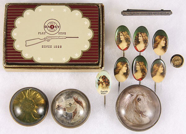 A DECK OF DAISY AIR RIFLE PLAYING CARDS: A DECK OF DAISY AIR RIFLE PLAYING CARDS, a Smith Guns pin, three bridal rosettes, six celluloid lapel pins with young beauties, and other items.