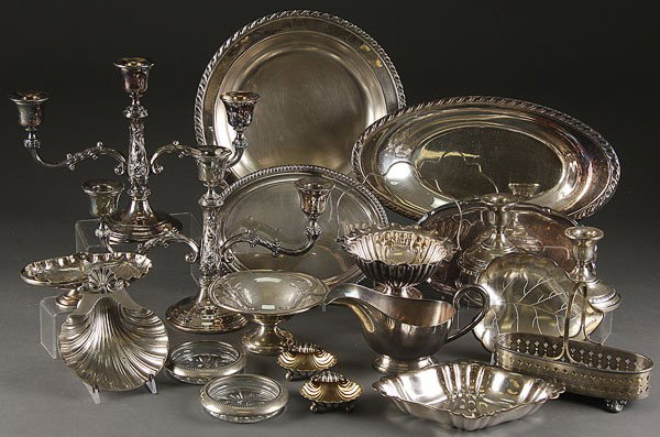 REED & BARTON, REGIS, SHEFFIELD, INTERNATIONAL: REED & BARTON, REGIS, SHEFFIELD, INTERNATIONAL SILVERPLATE GROUP, 20TH CENTURY. 24 pieces including 3-arm candelabra, staling "Columbia" weighted candle holders, Walker and Hall by Sheffield, oval ray