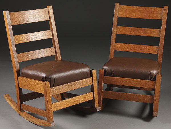 L & J.G. STICKLEY ARTS AND CRAFTS OAK ROKERS: A PAIR OF L & J.G. STICKLEY ARTS AND CRAFTS OAK SEWING ROCKERS, EARLY 20TH CENTURY. With three horizontal slat backs and later leather upholstered cushions. Height 31 inches, width 17 inches.