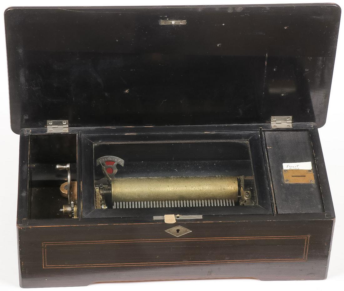 SWISS COIN OPERATED MUSIC BOX: SWISS COIN OPERATED MUSIC BOX. Comprising a traditional cylinder music box with rudimentary coin slot on interior, 7.25-inch cylinder. Seems to operate fine. Height 5.8 inches, width 18.25 inches, dep