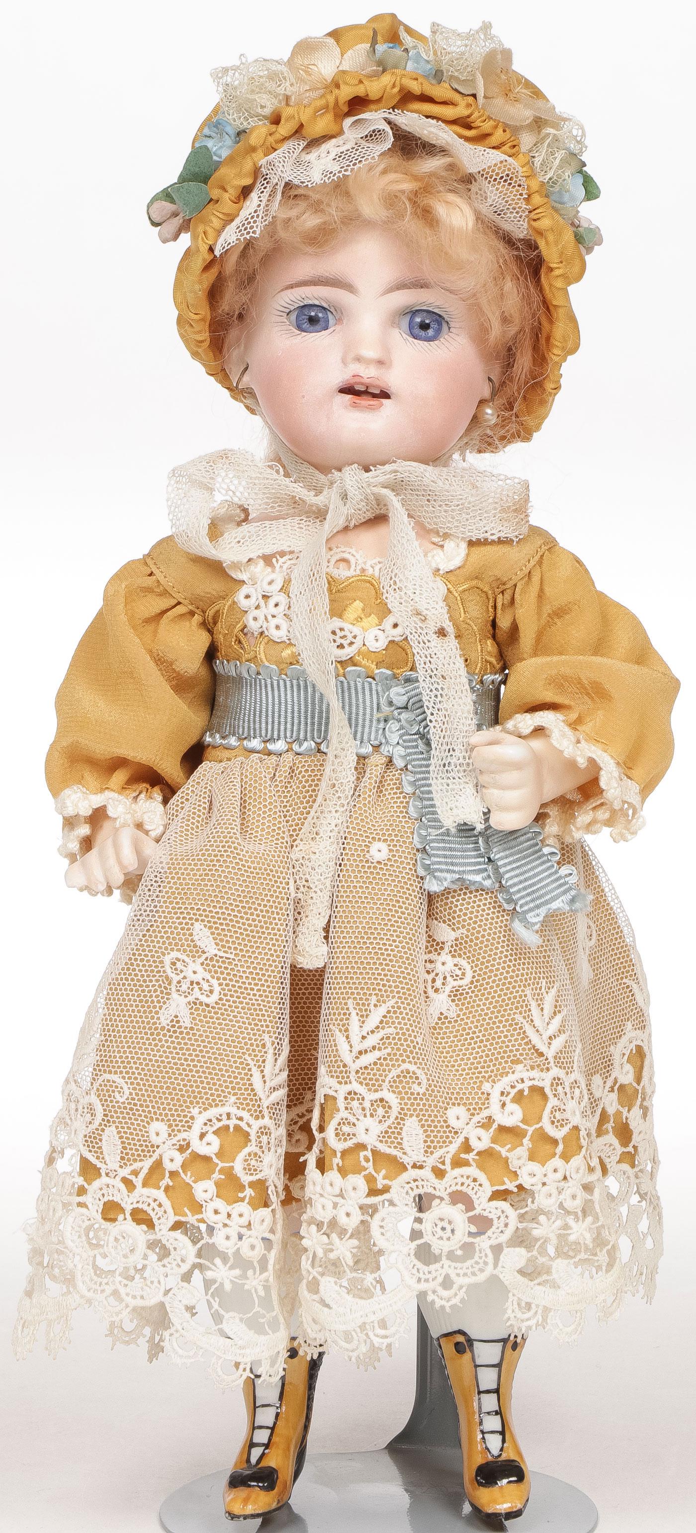 GREAT KESTNER ALL BISQUE "WRESTLER" DOLL: GREAT KESTNER ALL BISQUE "WRESTLER" DOLL. The bisque swivel head on jointed all-bisque body with plump modeling of legs, bent left arm, painted knee stockings and gold bootines with black detail and h