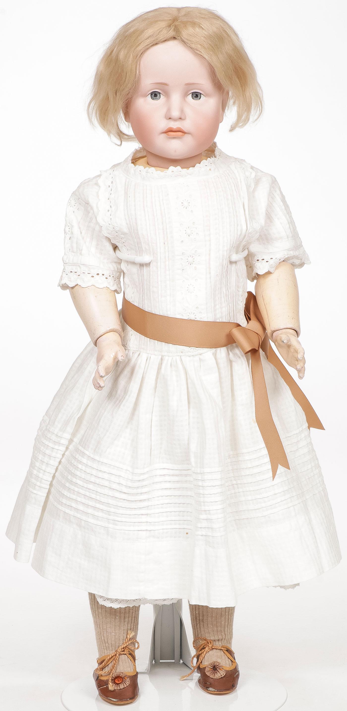 24 INCH KAMMER & REINHART NO. 114 CHARACTER DOLL: 24 INCH KAMMER & REINHART NO. 114 CHARACTER DOLL. The Gretchen doll with bisque socket head having dark blue painted eyes and closed pouty mouth, with original wig (a few wig pulls), exhibiting no chi