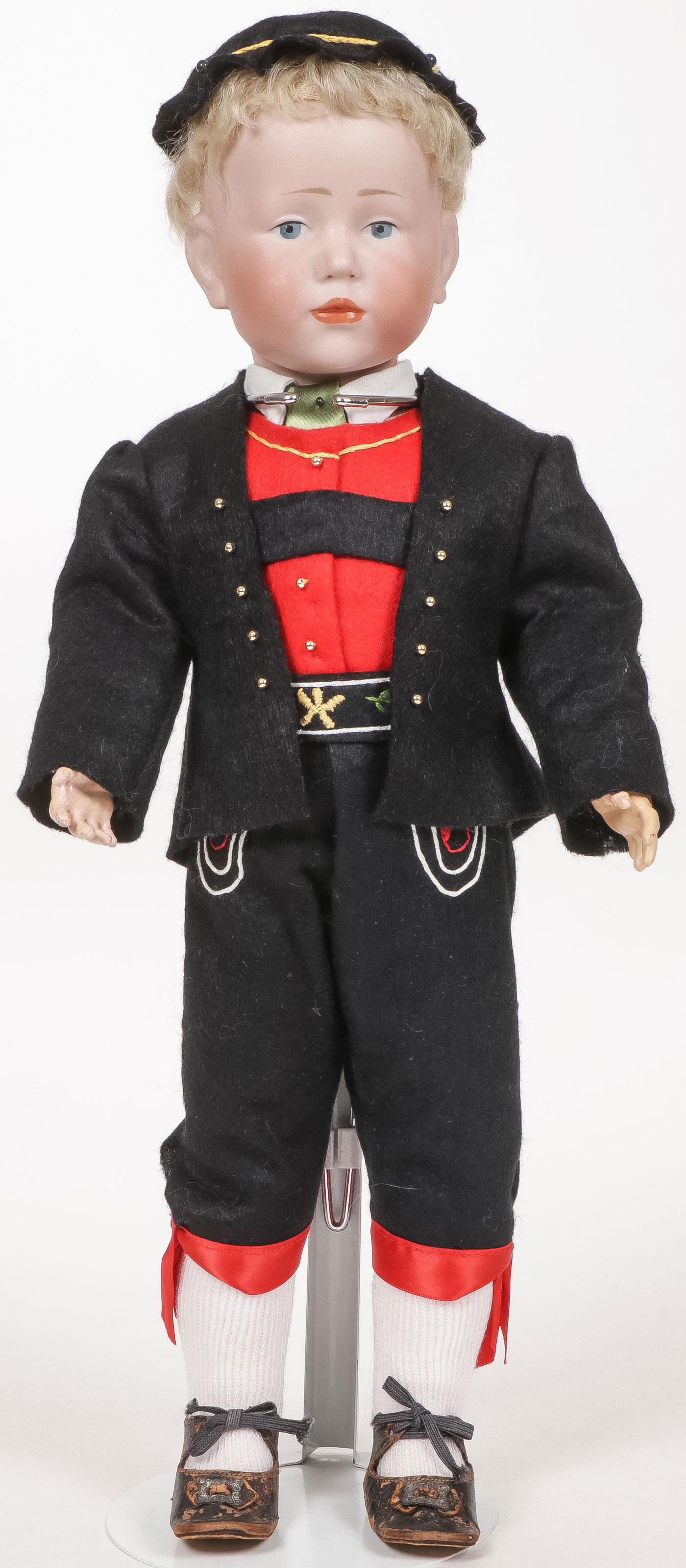 17 INCH KAMMER & REINHART NO. 101 CHARACTER DOLL: 17 INCH KAMMER & REINHART NO. 101 CHARACTER DOLL. The Peter doll with bisque socket head, having painted blue eyes and closed mouth, with original wig, exhibiting no chips, cracks, or hairlines, with