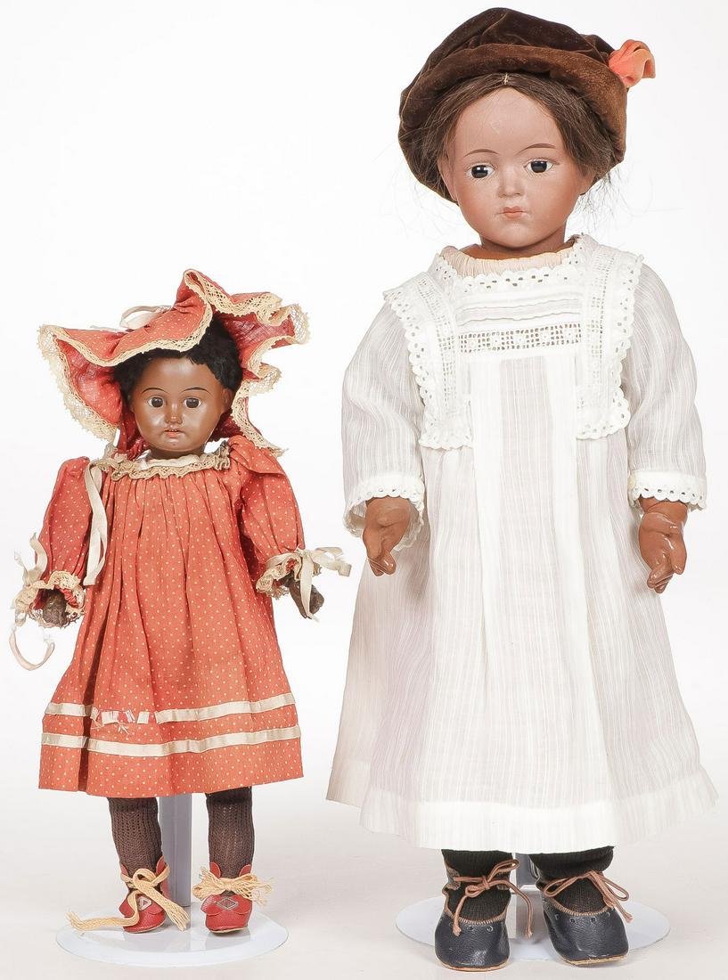 FRENCH AND GERMAN BLACK BISQUE DOLLS: FRENCH AND GERMAN BLACK BISQUE DOLLS. Including a De Fuisseaux example with good jointed compo body and a smaller German example with strung wood body, greatest height 17 inches.SHIPPING NOTICE:Jack