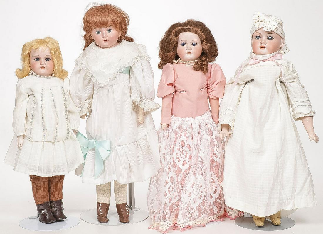 FOUR GERMAN BISQUE DOLLS: FOUR GERMAN BISQUE DOLLS. Including an A & M Floradora, an A & M -2-DEP, and two others as shown, one with restored head. Greatest Height 19 inches.SHIPPING NOTICE:Jackson's is your sole and only so