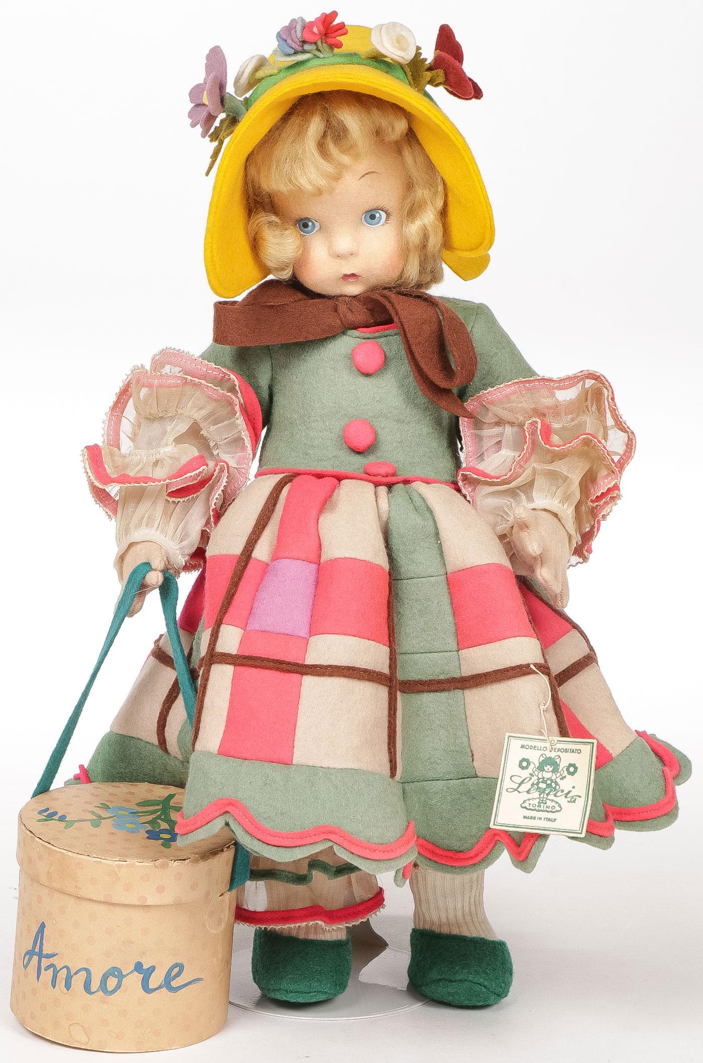 11 INCH FELT LENCI DOLL C 1930: 11 INCH FELT LENCI DOLL C 1930. Adorable with original hat box and tag, having a few moth holes but colors still bright, very little surface dirt.SHIPPING NOTICE:Jackson's is your sole and only sour