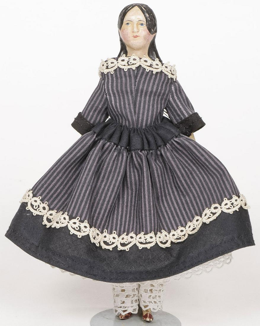 PETITE PAPIER MACHE MILLINER MODEL DOLL: PETITE PAPIER MACHE MILLINER MODEL DOLL. With carved wood, arms, and legs, sausage curls, height 6 inches.SHIPPING NOTICE:Jackson's is your sole and only source for one stop packing and shipping. Wi