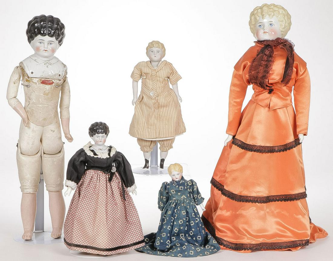FIVE CHINA HEAD DOLLS: FIVE CHINA HEAD DOLLS. Various sizes and hair colors, one in bisque finish and one marked Ethel on breast (far left). Greatest height 21.5 inches.SHIPPING NOTICE:Jackson's is your sole and only sour