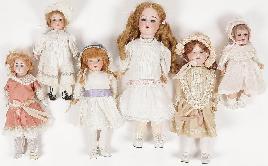 SIX GERMAN BISQUE DOLLS: SIX GERMAN BISQUE DOLLS. Including various makers such as A & M, Heuback Koppelsdorf, and others as shown. Greatest height 17.5 inchesSHIPPING NOTICE:Jackson's is your sole and only source for one s