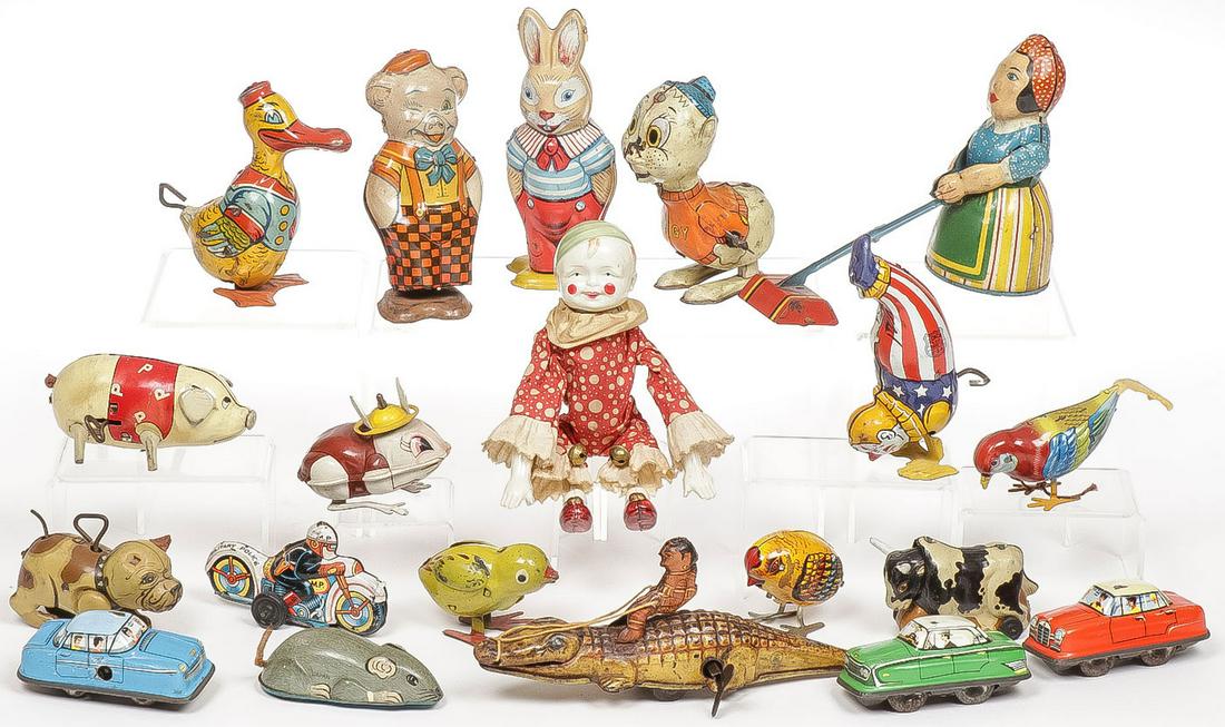 20 VINTAGE TIN WIND UP TOYS: 20 VINTAGE TIN WIND UP TOYS. Comprising 20 individual pieces including a good celluloid acrobatic clown, British maid cleaning woman (top right) and other various figures including a rabbit, pig, chic