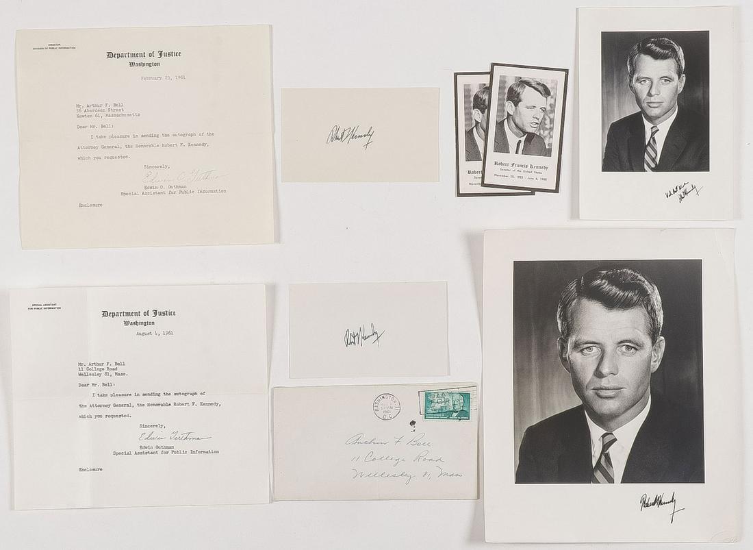 ROBERT KENNEDY SIGNED PHOTOS & MORE: ROBERT KENNEDY SIGNED PHOTOS & MORE. Comprising an 8" x 10" photo of Kennedy as Attorney General signed on lower right margin, very minor ink smudge, and crinkled corner. As well as two signed index c
