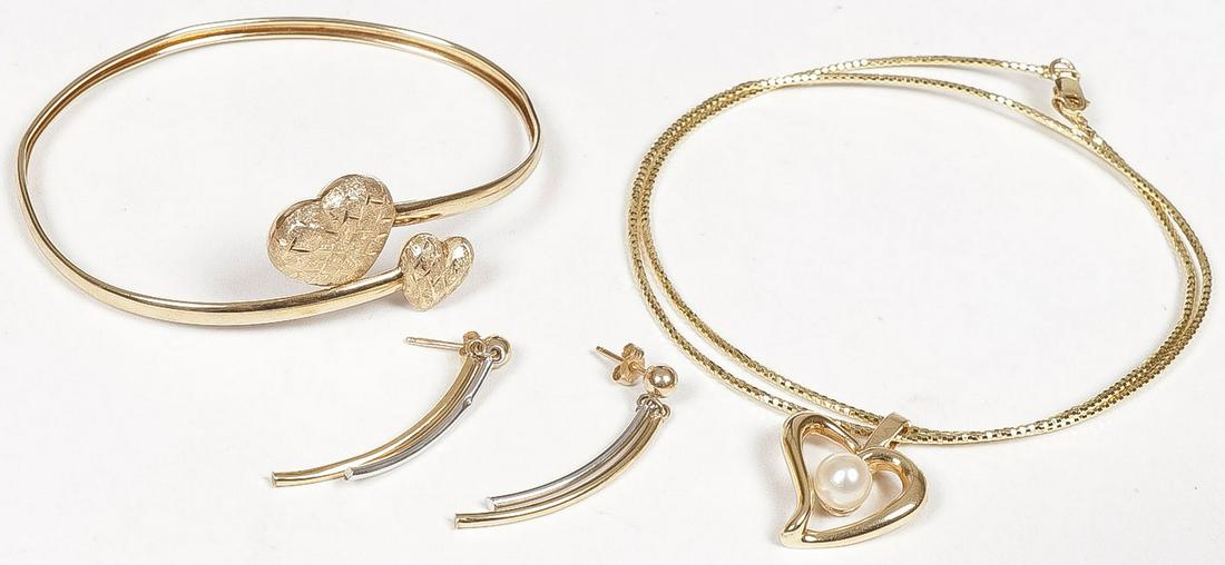 LADIES GOLD JEWELRY GROUP: LADIES GOLD JEWELRY GROUP. Comprising a 14 karat gold open-heart pendant set with small pearl on 14 karat gold chain, (4.2 dwt), a 10 karat gold bangle bracelet with heart ends (2.4 dwt), and a pair o