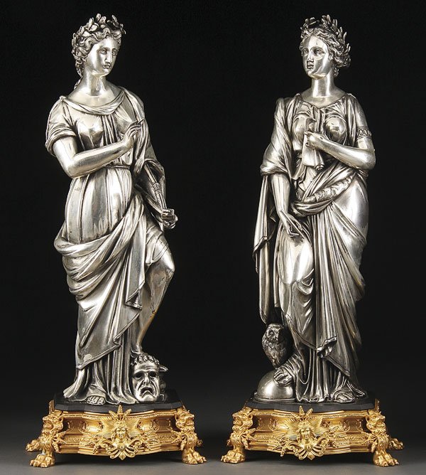 NAPOLEON III SILVERED & ORMOLU GARNITURE: A NAPOLEON III SILVERED AND ORMOLU FIGURAL GARNITURE OF THE ARTS. The silvered classical figures of a young beauty representing literature and theater surmounting ormolu plinths with figural lions fee