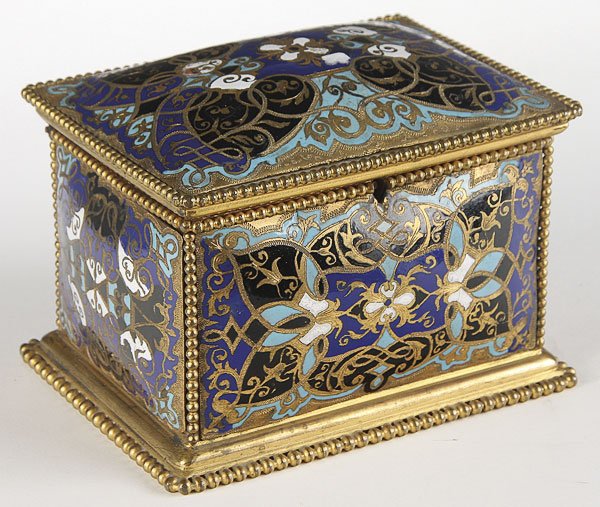 FRENCH CHAMPLEVE ENAMELED GILT BRONZE CASKET 19TH: A FINE FRENCH CHAMPLEVÉ ENAMELED AND GILT BRONZE LIDDED CASKET, 19TH CENTURY. Of rectangular form with convex panels in an Arabesque design, the interior with a diamond quilted silk satin lining. Len