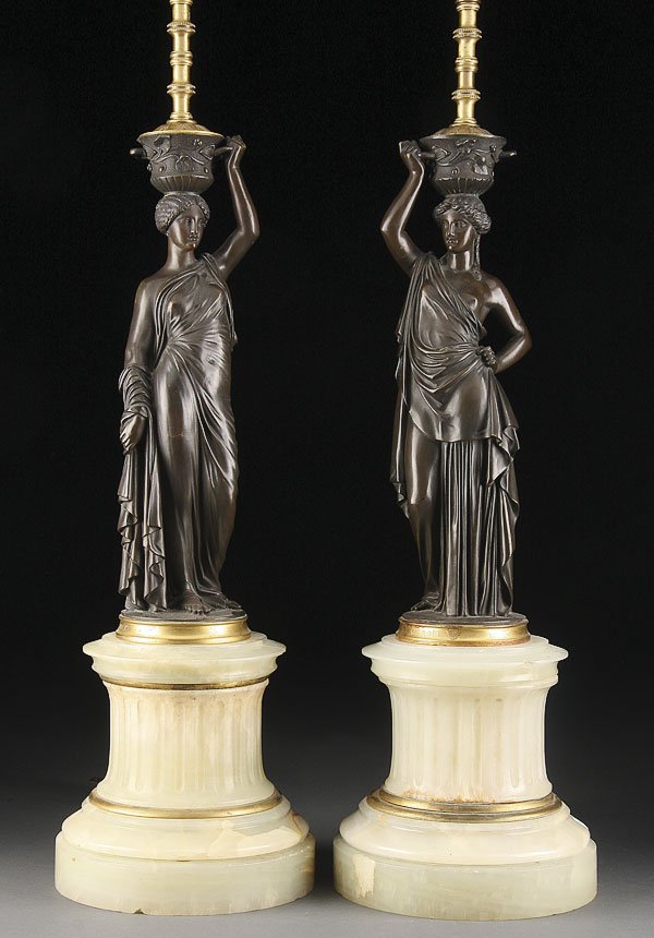 AFTER L.V.E. ROBERT, BRONZE FIGURAL CANDELABRAS: AFTER LOUIS VALENTIN ELIS ROBERT (FRENCH 1821-1874) A pair of bronze figural candelabra modeled as classical women supporting a handled urn, raised on fluted onyx pedestals and later converted to elec