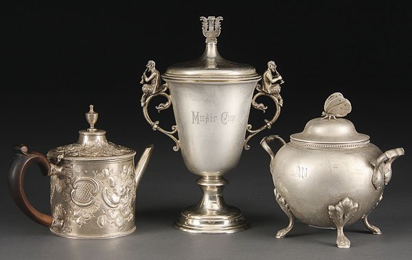 3 PIECE SILVER GROUP, 19TH C. TO EARLY 20TH C.: A THREE PIECE SILVER GROUP, 19TH/EARLY 20TH CENTURY. Comprising a fine Early Victorian English silver Argyll with repousse foliates (worn hallmarks), an English handled covered "Music Cup" with figura