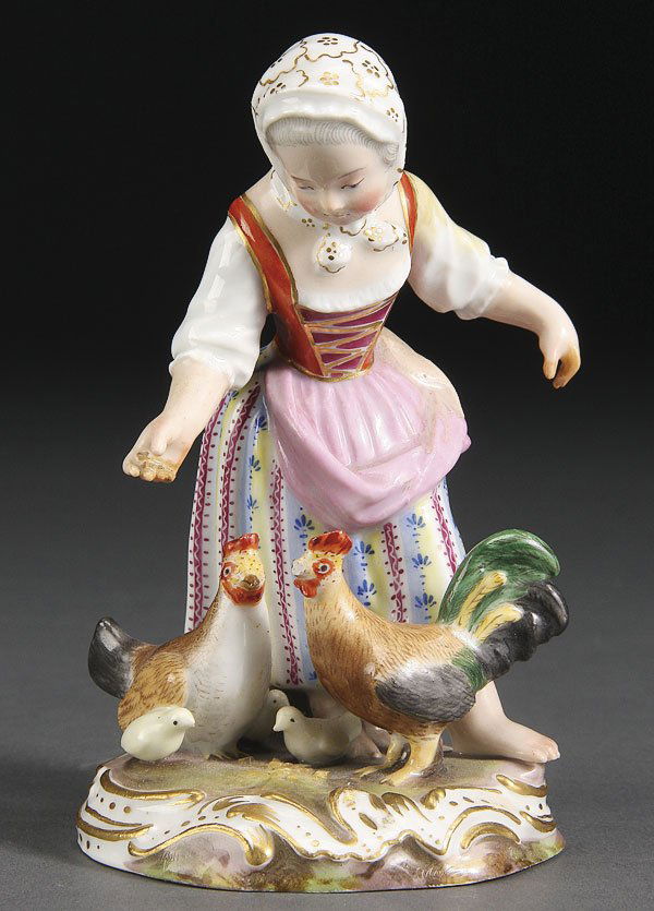 MEISSEN STYLE PORCELAIN FIGURE, 19TH/20TH C.: A MEISSEN STYLE PORCELAIN FIGURE, 19TH/20TH CENTURY. Modeled as a woman feeding chickens, blue crossed swords style mark on base. Height 4.5 inches (11.5 cm).
