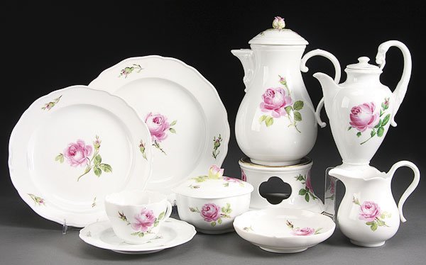 SERVICE OF MEISSEN PORCELAIN DINNERWARE: A 44 PIECE SET OF MEISSEN PORCELAIN DINNERWARE, 20TH CENTURY. Partial service comprising coffee pot with warming base, ten saucers, eight cups, ten sauce bowls, creamer and sugar, and ten various plat