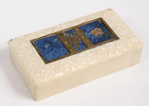 NEO-CLASSIC CARVED IVORY, LAPIS, SILVER GILT BOX: A CONTINENTAL NEO-CLASSIC CARVED IVORY, SILVER GILT AND LAPIS MOUNTED LIDDED BOX, 19TH CENTURY. The hinged cover carved with intaglio scrollwork inset with three blue lapis tiles within a silver gilt