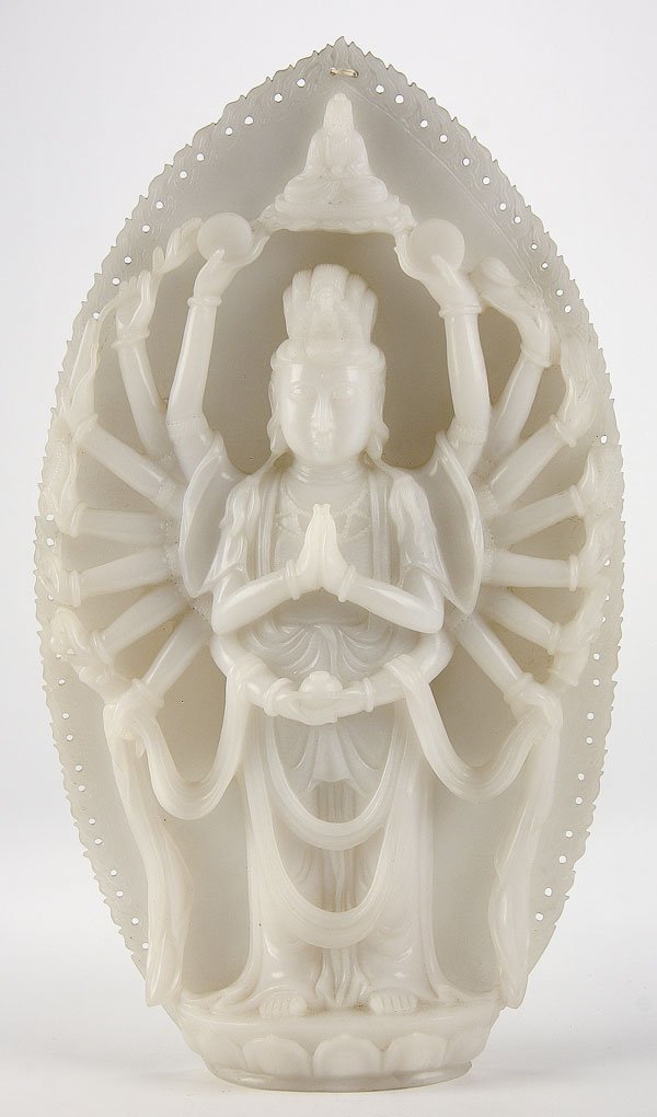 LARGE ANTIQUE CHINESE CARVED WHITE JADE GUANYIN: A LARGE CHINESE CARVED WHITE JADE GUANYIN, LATE 19TH/EARLY 20TH CENTURY. Well carved in an even toned semi translucent white jade in the form of a multi-armed Deity holding various Buddhist attributes
