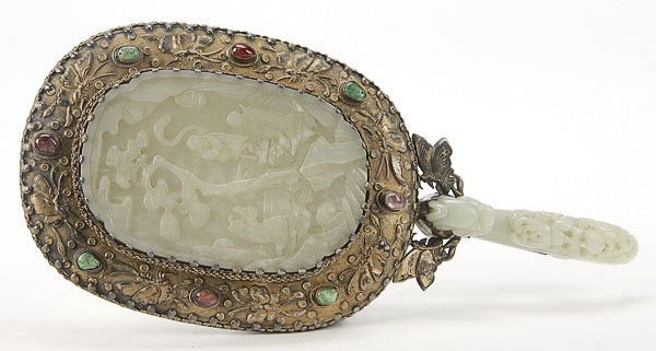 CHINESE CARVED WHITE JADE PLAQUE & MIRROR, QING: A VERY FINE CHINESE CARVED WHITE JADE PLAQUE AND BELT HOOK SILVER-GILT HAND MIRROR, QING DYNASTY. With later mountings, The white jade of a good pale celadon and even tone, carved as a plaque with thr