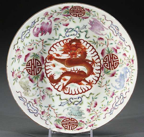 CHINESE FAMILLE ROSE PORCELAIN DRAGON & BATS BOWL: A CHINESE FAMILLE ROSE PORCELAIN "DRAGON AND BATS" LOW BOWL. The interior finely painted with a red and gilt dragon, five bats, peaches and Buddhist symbols, red Guangxu six character reign mark. Diam