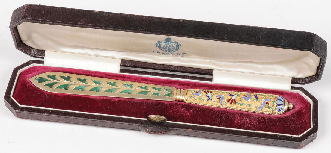 CASED RUSSIAN SILVER GILT & ENAMEL PAPER KNIFE: CASED RUSSIAN SILVER GILT & ENAMEL PAPER KNIFE, GRACHEV The gilt-silver handle overall enameled in cloisonne with scrolling vines on a stippled gilt ground, the flared silver gilt knife blade with pla