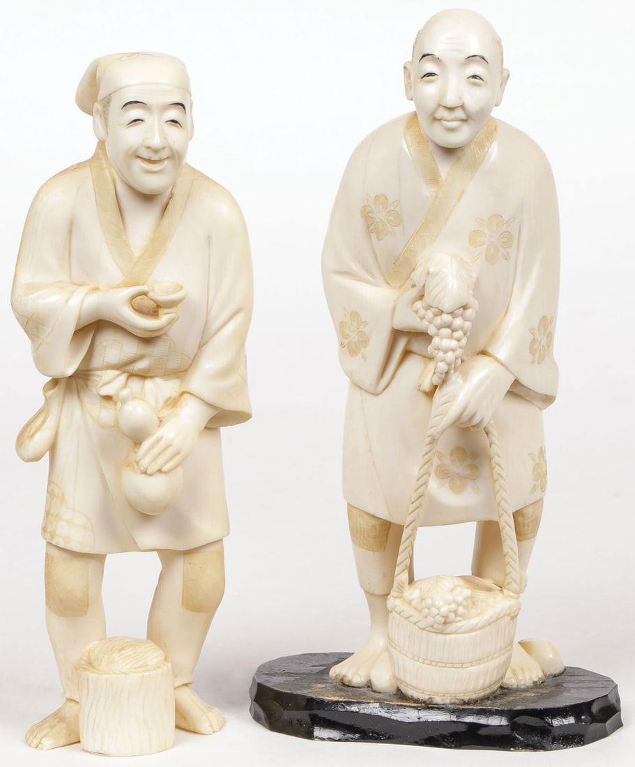 PAIR JAPANESE OKIMONO, MEIJI: PAIR JAPANESE OKIMONO, MEIJI Both carved in full round with excellent detailing, depicting a grape vendor and a wine vendor, one artist signed on underside. Each figure 5 inches (13 cm). NO INTERNATIO