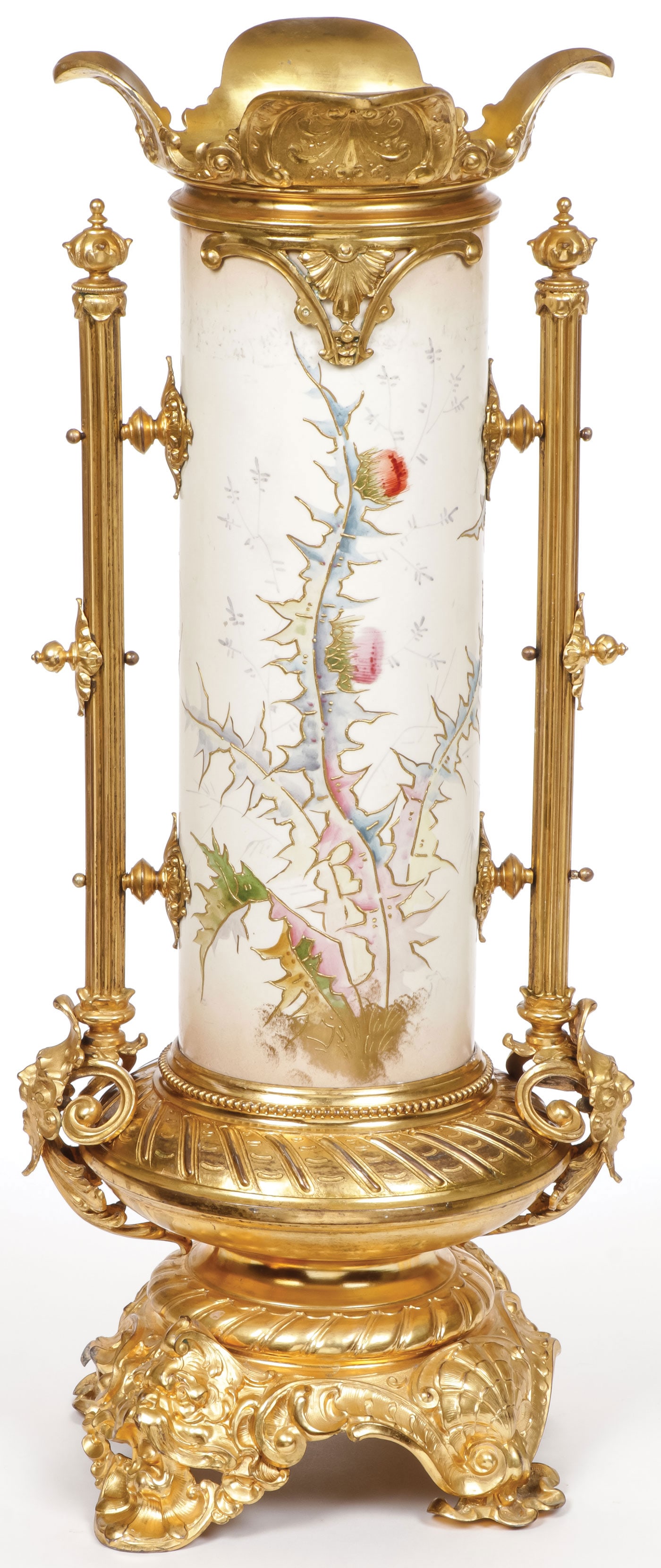 BEAUTIFUL ORMOLU VASE, CIRCA 1890: BEAUTIFUL ORMOLU VASE, CIRCA 1890 Comprising a cylindrical vase with painted and raised gilt decoration depicting thistles, Royal Bonn crown and shield mark, set in a spectacular ornate gilt metal sta
