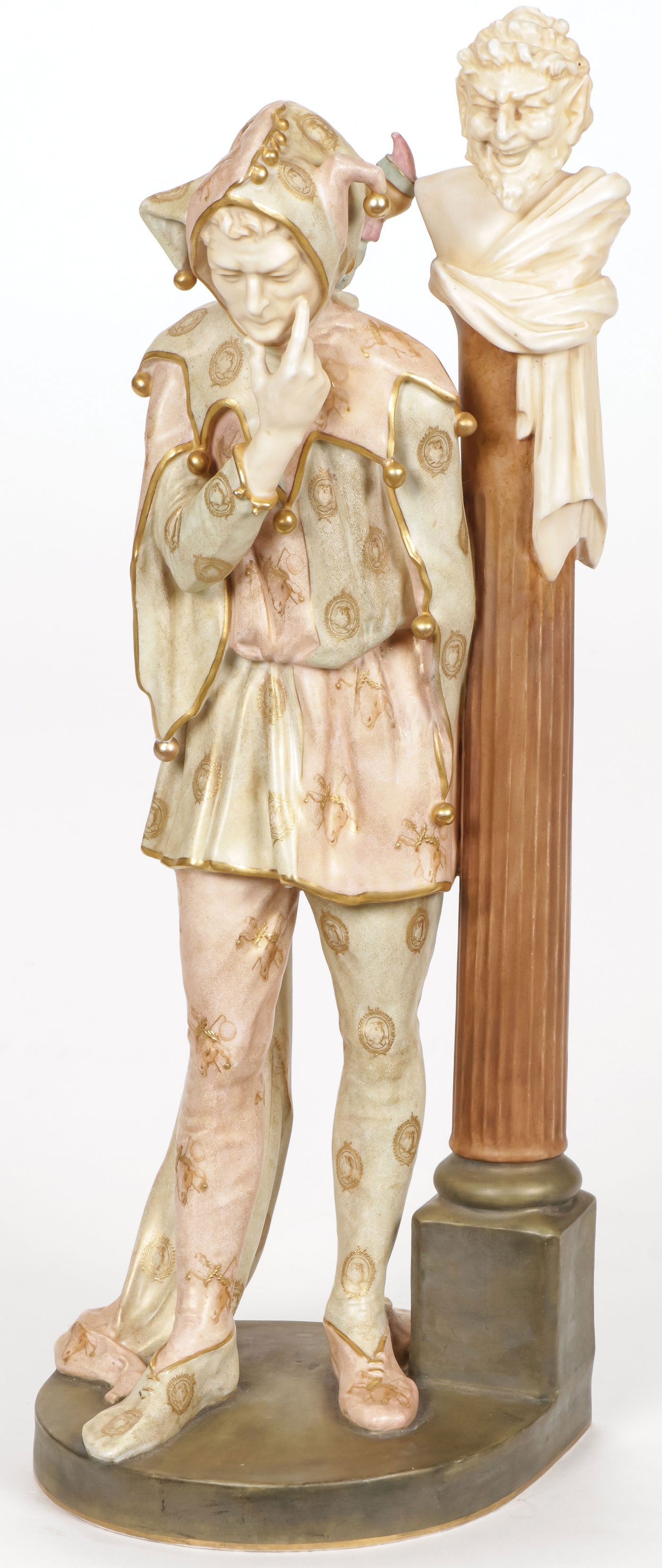 RARE DOULTON BURSLEM VELLUM DOUBLE JESTER BY NOKE: RARE DOULTON BURSLEM VELLUM DOUBLE JESTER BY NOKE Comprising a large and impressive figure of a double face jester holding a marotte standing next to a fluted column with bust. In vellum finish with e