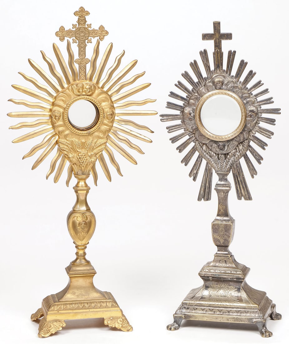 A PAIR OF MONSTRANCES 19TH C: A PAIR OF MONSTRANCES 19TH C. One in gilt finish the other silver finish, both with cross finials and each with luna, greatest height 18.25 inches (46cm). SHIPPING NOTICE: Jackson's is your sole and