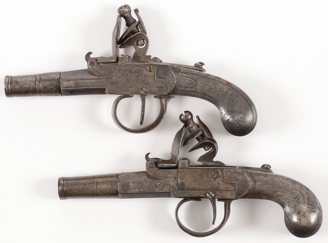 PAIR OF ALL METAL FLINTLOCK PISTOLS, SEGLAS: PAIR OF ALL METAL FLINTLOCK PISTOLS, SEGLAS Comprising a pair of English all metal, box lock flintlock pocket pistols. Tapering round screw off barrels, engraved overall, marked SEGLAS and LONDON. Bot
