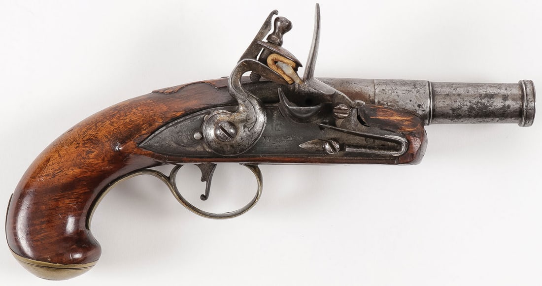 ENGLISH J. WAREN FLINTLOCK PISTOL: ENGLISH J. WAREN FLINTLOCK PISTOL 50 caliber, 3.75" barrel with proof marks, brass hardware, walnut stock, holds a cock in both positions. Overall length 7.6 inches. SHIPPING NOTICE: Jackson's is you