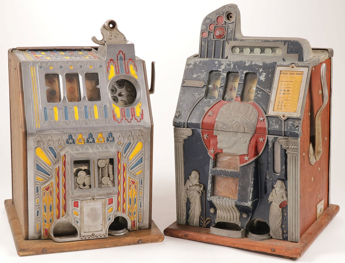 PAIR VINTAGE 5 CENT SLOT MACHINES: PAIR VINTAGE 5 CENT SLOT MACHINES Comprising a Mills 5 cent Roman Head slot machine, coins drop, wheels turn, could use a little TLC. Height 25.5 inches. Together with a Pace Comet 5 cent slot machine